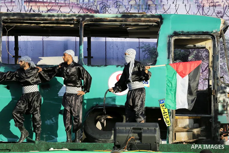 A mock burnt Israeli bus is seen on a stage during an anti-Israel rally organised by the Palestinian Hamas movement in Gaza city April 28, 2016. Photo by Mohammed Asad