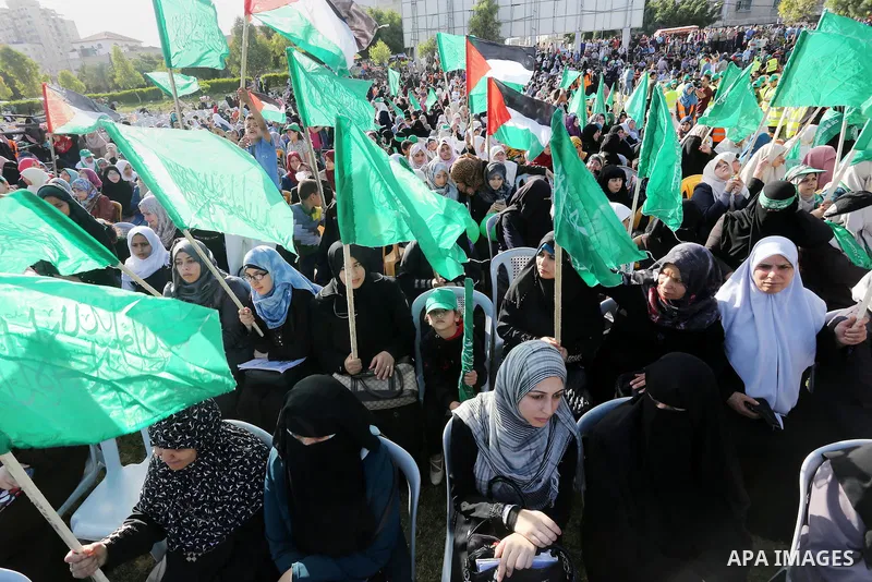 Palestinian supporters of the Islamist movement Hamas take part during an anti-Israel rally in Gaza City on April 28, 2016. Photo by Mohammed Asad