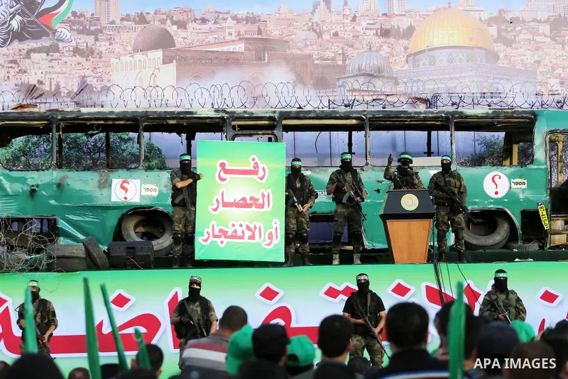 A member of the Ezzedine al-Qassam Brigades, the military wing of the Palestinian Islamist movement Hamas, delivers a speech during an anti-Israel rally in Gaza City on April 28, 2016. Photo by Mohammed Asad