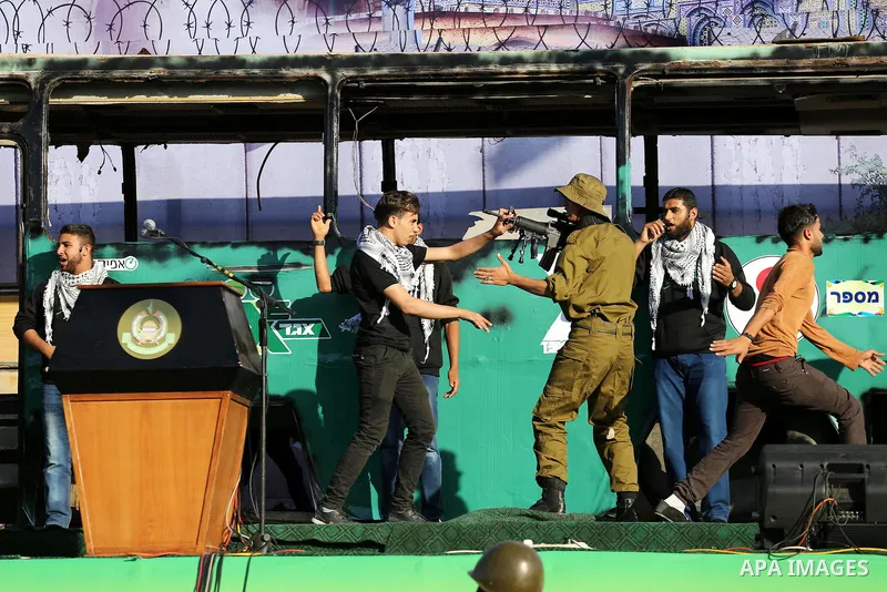 A mock burnt Israeli bus is seen on a stage during an anti-Israel rally organised by the Palestinian Hamas movement in Gaza city April 28, 2016. Photo by Mohammed Asad