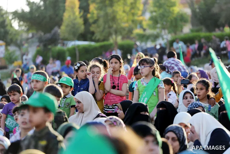 Palestinian supporters of the Islamist movement Hamas take part during an anti-Israel rally in Gaza City on April 28, 2016. Photo by Mohammed Asad