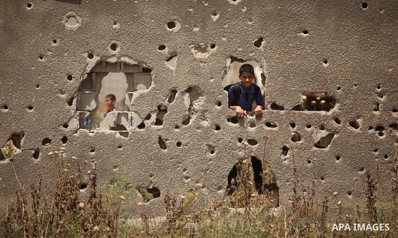 Palestinian boys play on the rubbles of houses, which were destroyed during the recent Israeli war 2014, in Shijaiyah neighborhood in the east of Gaza city, on April 30, 2016. Israel’s punitive ban on cement imports into...