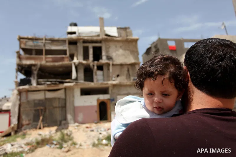 Palestinian boys play on the rubbles of houses, which were destroyed during the recent Israeli war 2014, in Shijaiyah neighborhood in the east of Gaza city, on April 30, 2016. Israel’s punitive ban on cement imports into...
