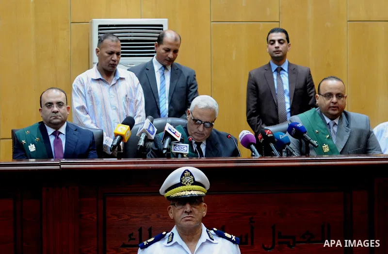 The Judges attend the trial of Egyptian defendants over a 2012 stadium riot in the canal city of Port Said at the police academy on the outskirts of the capital Cairo on April 30, 2016. Seven defendants wait for the verd...
