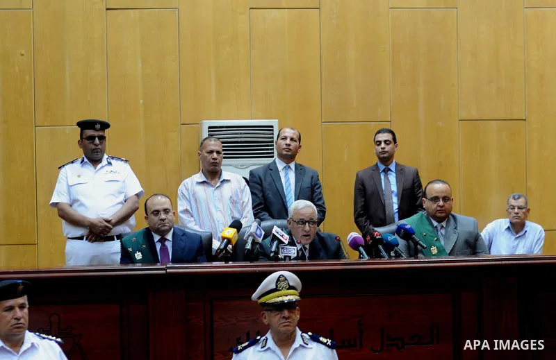 The Judges attend the trial of Egyptian defendants over a 2012 stadium riot in the canal city of Port Said at the police academy on the outskirts of the capital Cairo on April 30, 2016. Seven defendants wait for the verd...