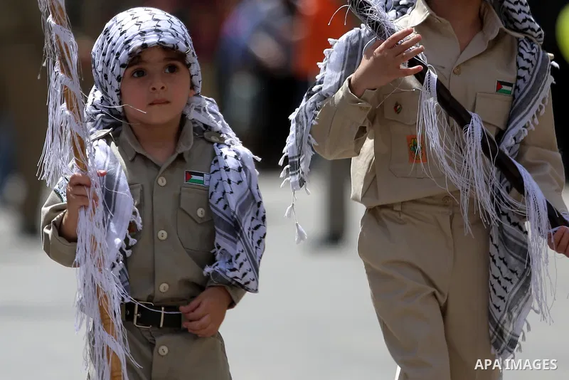 Palestinian christians march in the traditional Sabt al-Nour parade, in the West Bank city of Ramallah, on April 30, 2016. The Holy Fire is described by Orthodox Christians as a miracle that occurs every year at the Chur...