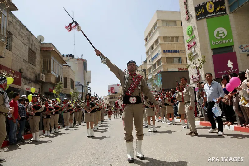 Palestinian christians march in the traditional Sabt al-Nour parade, in the West Bank city of Ramallah, on April 30, 2016. The Holy Fire is described by Orthodox Christians as a miracle that occurs every year at the Chur...