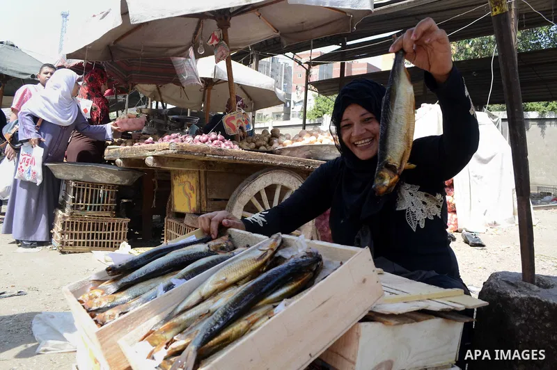 Egyptians buy the Herring or, salted fish during preparation for the upcoming the Sham El Nessim, or the Festival of Spring Breeze, which marks the beginning of spring, in Cair, on April 30, 2016. Photo by Amr Sayed