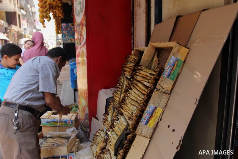 Egyptians buy the Herring or, salted fish during preparation for the upcoming the Sham El Nessim, or the Festival of Spring Breeze, which marks the beginning of spring, in Cair, on April 30, 2016. Photo by Amr Sayed