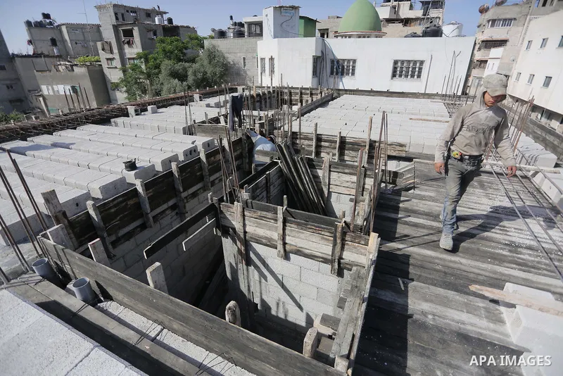 Palestinian construction workers built at a new house during the Workers' Day, in Gaza city, on May, 1, 2016. Photo by Mohammed Asad