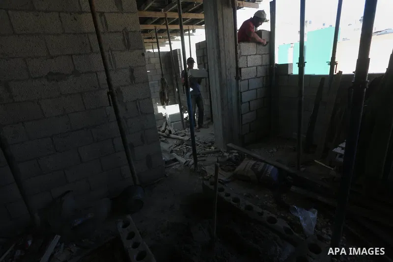 Palestinian construction workers built at a new house during the Workers' Day, in Gaza city, on May, 1, 2016. Photo by Mohammed Asad