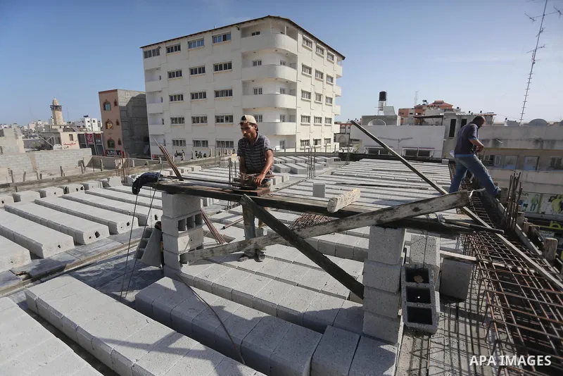 Palestinian construction workers built at a new house during the Workers' Day, in Gaza city, on May, 1, 2016. Photo by Mohammed Asad