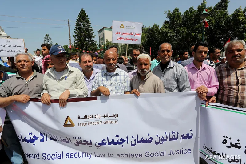 Palestinian workers demonstrate against the Israeli blockade of the Gaza Strip during a rally marking May Day, on May 1, 2016, in Gaza City. Israel has maintained a blockade of Gaza since 2006, and recently banned the su...
