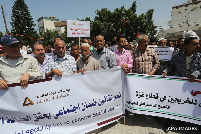 Palestinian workers demonstrate against the Israeli blockade of the Gaza Strip during a rally marking May Day, on May 1, 2016, in Gaza City. Israel has maintained a blockade of Gaza since 2006, and recently banned the su...