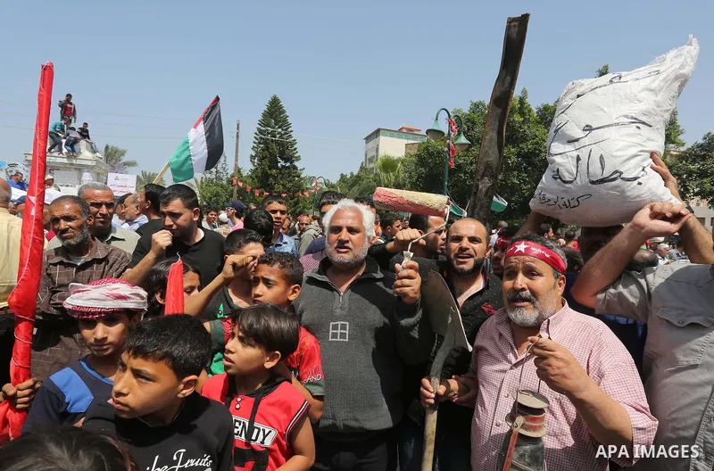 Palestinian workers demonstrate against the Israeli blockade of the Gaza Strip during a rally marking May Day, on May 1, 2016, in Gaza City. Israel has maintained a blockade of Gaza since 2006, and recently banned the su...