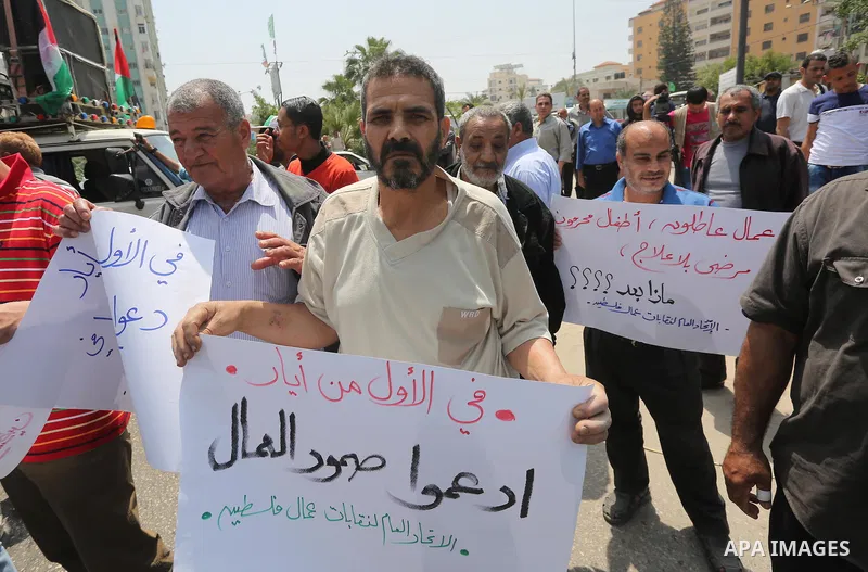 Palestinian workers demonstrate against the Israeli blockade of the Gaza Strip during a rally marking May Day, on May 1, 2016, in Gaza City. Israel has maintained a blockade of Gaza since 2006, and recently banned the su...