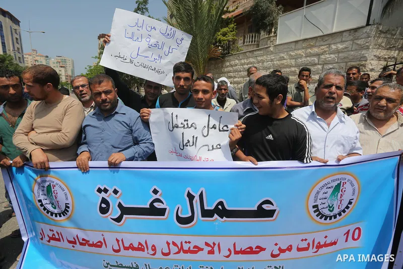 Palestinian workers demonstrate against the Israeli blockade of the Gaza Strip during a rally marking May Day, on May 1, 2016, in Gaza City. Israel has maintained a blockade of Gaza since 2006, and recently banned the su...
