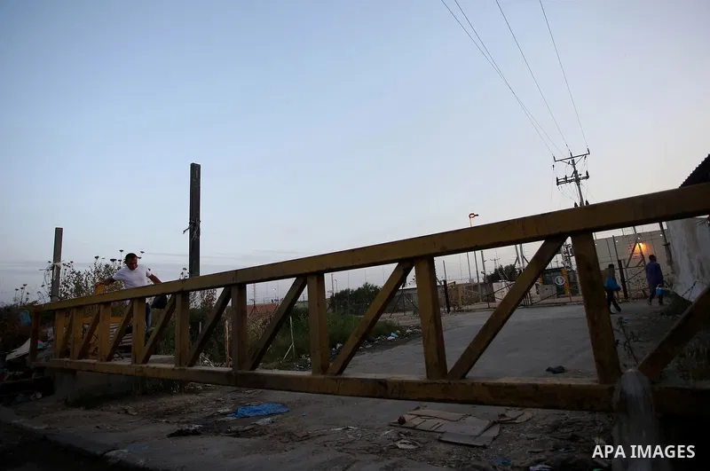 Palestinian labourers working in Israel wait to cross a checkpoint to go to work through the main Israeli terminal near the West Bank town of Qalqilya on International Workers' Day May 1, 2016. Photo by Stringer