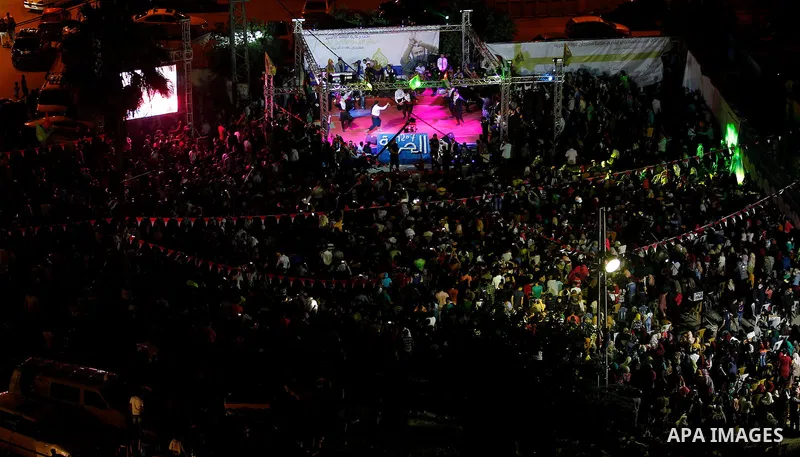 Palestinians take part in a opening ceremony of al-Hurria radio broadcasting office after the closure by the Israeli military, in the West Bank city of Hebron, on May 1, 2016. Photo by Wisam Hashlamoun