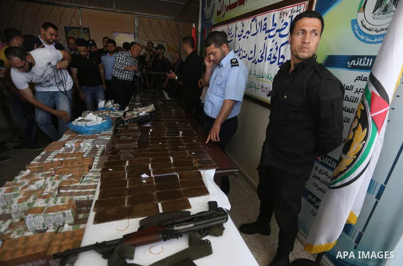 Palestinian anti-drug police participate in a conference drug damage in Gaza City on on May 2, 2016. Destroying the collected drugs was part of a new campaign by Hamas-run police to combat the usage of drugs and Tramadol...