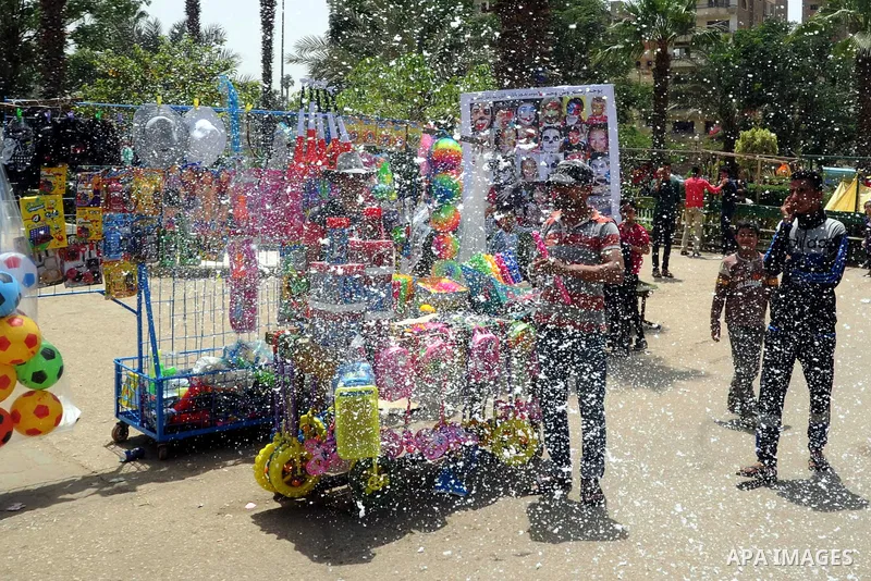 Egyptian children play at a garden marking Sham el-Nessim, or smelling the breeze which marks the beginning of spring, in Cairo, on May 02, 2016. Photo by Amr Sayed