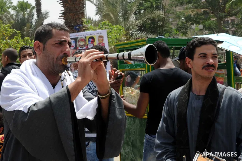 Egyptian musicians perform at a garden marking Sham el-Nessim, or smelling the breeze which marks the beginning of spring, in Cairo, on May 02, 2016. Photo by Amr Sayed