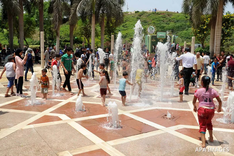 Egyptian children play at a garden marking Sham el-Nessim, or smelling the breeze which marks the beginning of spring, in Cairo, on May 02, 2016. Photo by Amr Sayed