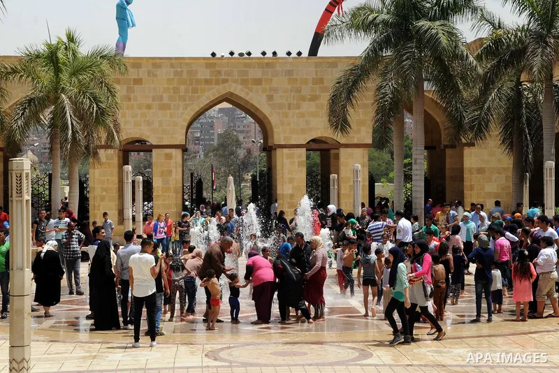 Egyptian children play at a garden marking Sham el-Nessim, or smelling the breeze which marks the beginning of spring, in Cairo, on May 02, 2016. Photo by Amr Sayed
