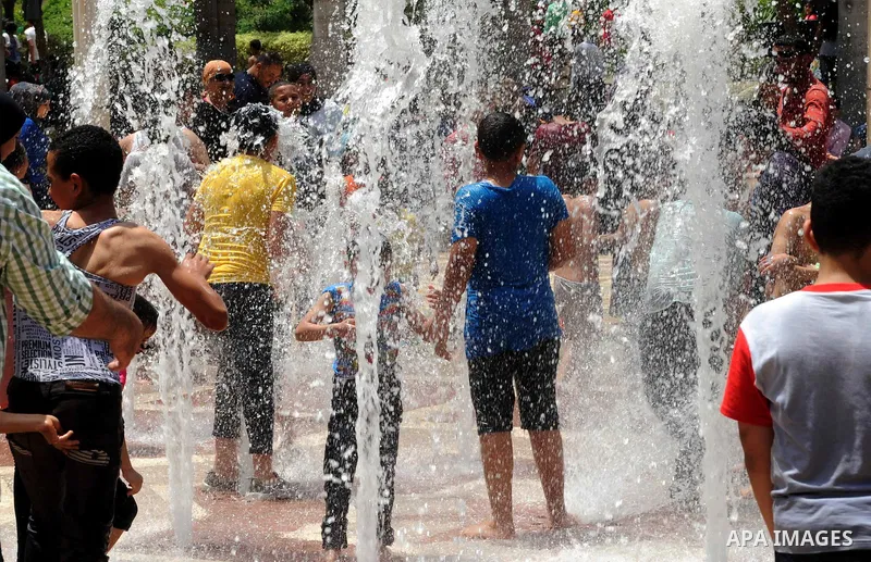 Egyptian children play at a garden marking Sham el-Nessim, or smelling the breeze which marks the beginning of spring, in Cairo, on May 02, 2016. Photo by Amr Sayed