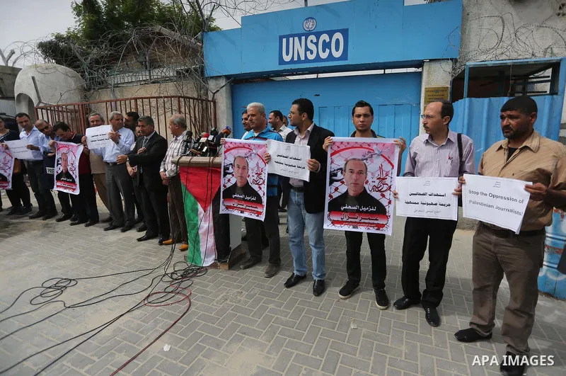 Palestinian Journalists hold banners during a protest calling for stop the Israeli violence against journalists to mark the World Press Freedom Day, in front of the headquarter United Nation "UNSCO" in Gaza City, on May...