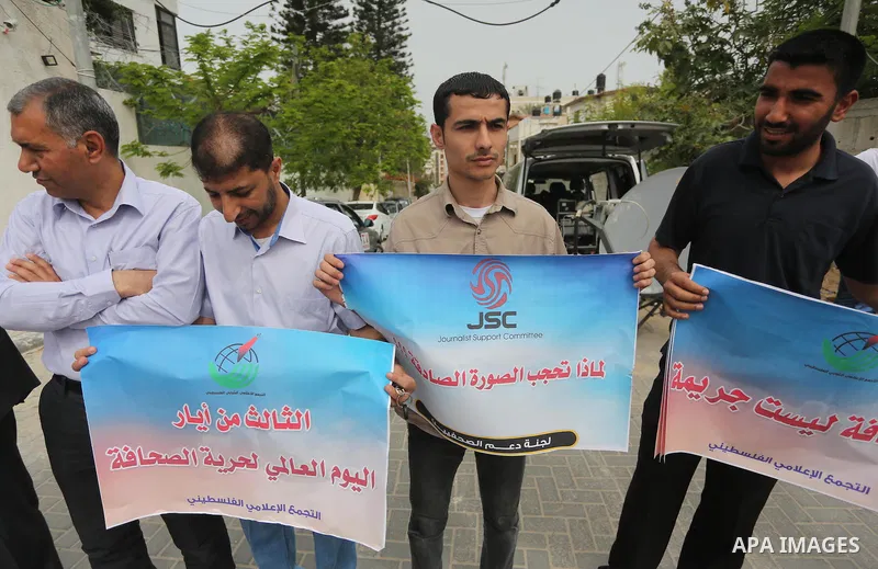 Palestinian Journalists hold banners during a protest calling for stop the Israeli violence against journalists to mark the World Press Freedom Day, in front of the headquarter United Nation "UNSCO" in Gaza City, on May...