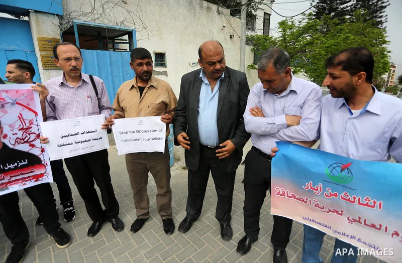 Palestinian Journalists hold banners during a protest calling for stop the Israeli violence against journalists to mark the World Press Freedom Day, in front of the headquarter United Nation "UNSCO" in Gaza City, on May...