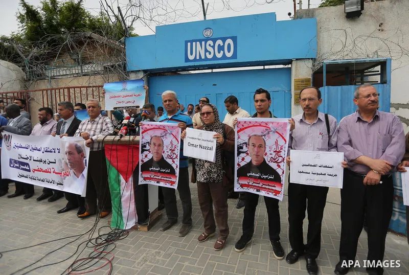 Palestinian Journalists hold banners during a protest calling for stop the Israeli violence against journalists to mark the World Press Freedom Day, in front of the headquarter United Nation "UNSCO" in Gaza City, on May...