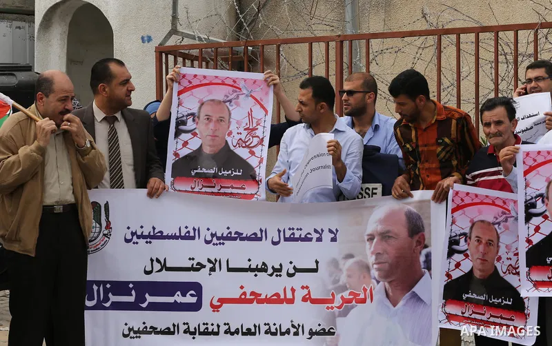 Palestinian Journalists hold banners during a protest calling for stop the Israeli violence against journalists to mark the World Press Freedom Day, in front of the headquarter United Nation "UNSCO" in Gaza City, on May...