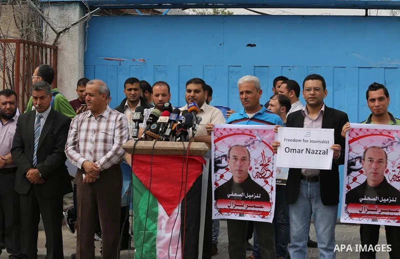 Palestinian Journalists hold banners during a protest calling for stop the Israeli violence against journalists to mark the World Press Freedom Day, in front of the headquarter United Nation "UNSCO" in Gaza City, on May...