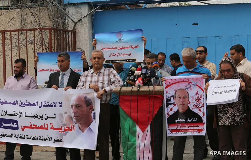 Palestinian Journalists hold banners during a protest calling for stop the Israeli violence against journalists to mark the World Press Freedom Day, in front of the headquarter United Nation "UNSCO" in Gaza City, on May...