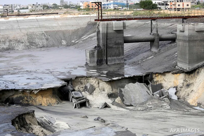 The damage are seen following the collapse one of sewage basins in the Zeitoun neighborhood, in Gaza city, on May 03, 2016. Photo by Mohammed Asad