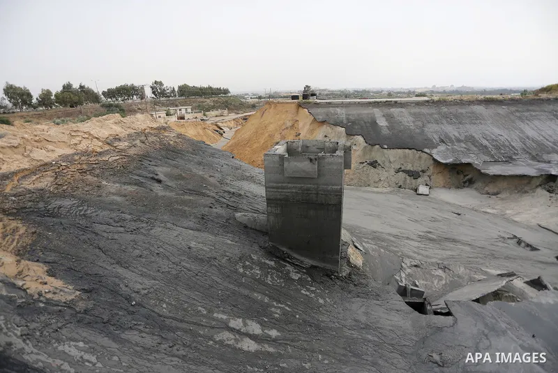 The damage are seen following the collapse one of sewage basins in the Zeitoun neighborhood, in Gaza city, on May 03, 2016. Photo by Mohammed Asad
