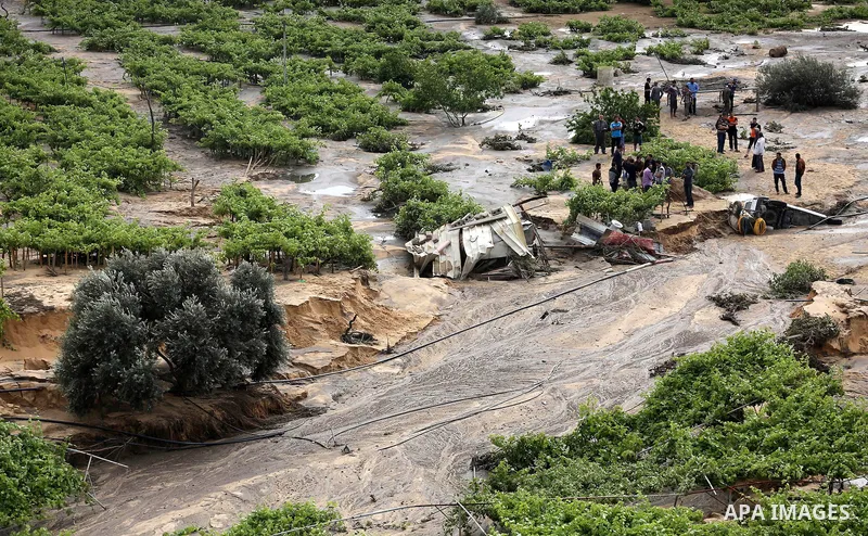 Palestinians inspect the damage following the collapse one of sewage basins in the Zeitoun neighborhood, in Gaza city, on May 03, 2016. Photo by Mohammed Asad