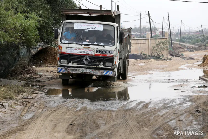 The damage are seen following the collapse one of sewage basins in the Zeitoun neighborhood, in Gaza city, on May 03, 2016. Photo by Mohammed Asad