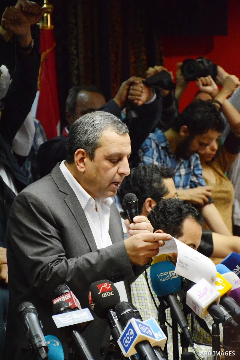 Egyptian Press Syndicate Chief Yahya Qalash reads a statement at the headquarters in the capital Cairo on May 3, 2016 on the occasion of World Press Freedom day, a day after police stormed the headquarters of the journal...