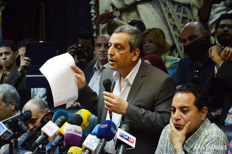 Egyptian Press Syndicate Chief Yahya Qalash reads a statement at the headquarters in the capital Cairo on May 3, 2016 on the occasion of World Press Freedom day, a day after police stormed the headquarters of the journal...