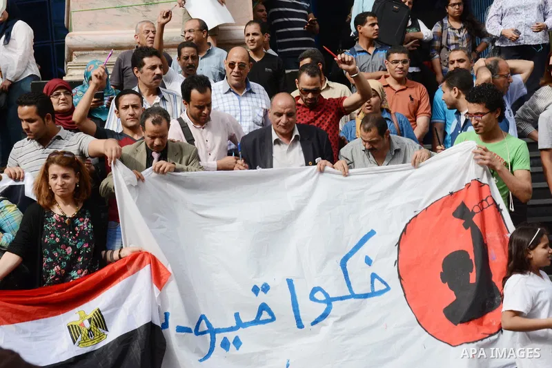 Egyptian Journalists take part during a protest against the arrests of fellow journalists outside the Egyptian Journalist syndicate headquarters in the capital Cairo on May 3, 2016 on the occasion of World Press Freedom...