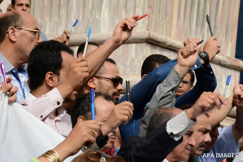 Egyptian Journalists take part during a protest against the arrests of fellow journalists outside the Egyptian Journalist syndicate headquarters in the capital Cairo on May 3, 2016 on the occasion of World Press Freedom...