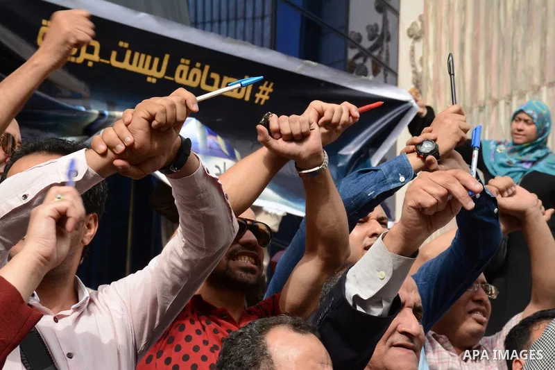 Egyptian Journalists take part during a protest against the arrests of fellow journalists outside the Egyptian Journalist syndicate headquarters in the capital Cairo on May 3, 2016 on the occasion of World Press Freedom...