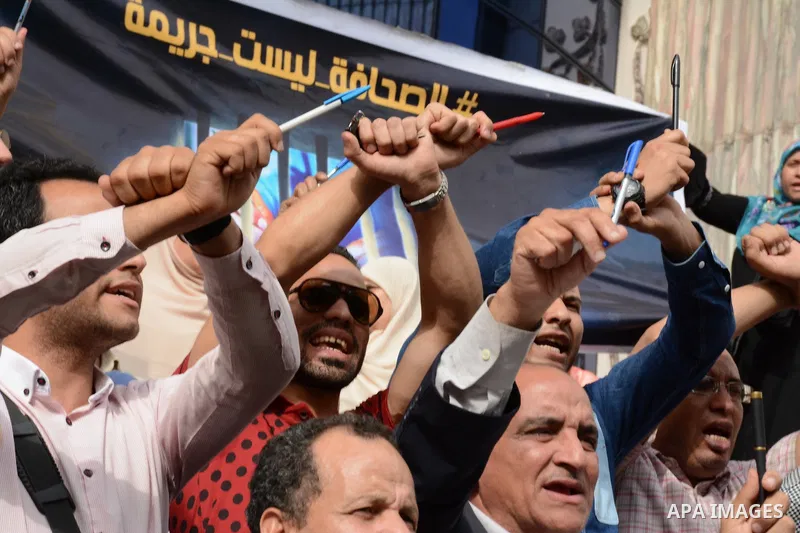 Egyptian Journalists take part during a protest against the arrests of fellow journalists outside the Egyptian Journalist syndicate headquarters in the capital Cairo on May 3, 2016 on the occasion of World Press Freedom...
