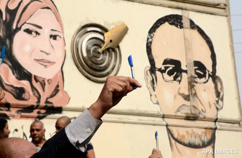 Egyptian Journalists take part during a protest against the arrests of fellow journalists outside the Egyptian Journalist syndicate headquarters in the capital Cairo on May 3, 2016 on the occasion of World Press Freedom...