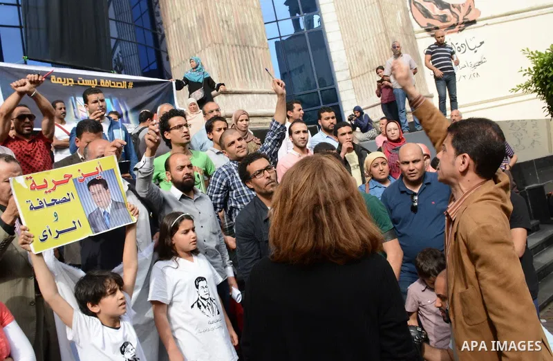 Egyptian Journalists take part during a protest against the arrests of fellow journalists outside the Egyptian Journalist syndicate headquarters in the capital Cairo on May 3, 2016 on the occasion of World Press Freedom...