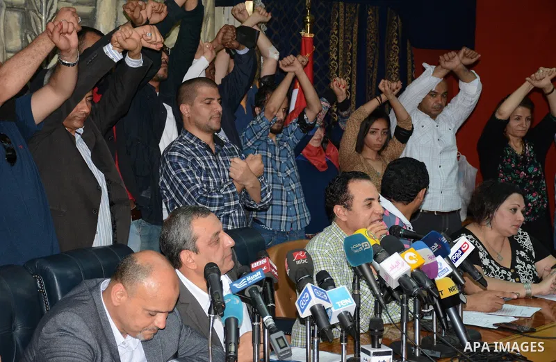 Egyptian Press Syndicate Chief Yahya Qalash reads a statement at the headquarters in the capital Cairo on May 3, 2016 on the occasion of World Press Freedom day, a day after police stormed the headquarters of the journal...
