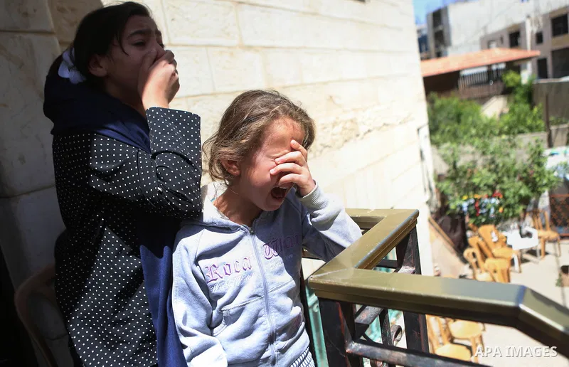 Relatives of Palestinian Ahmed Reyad Shehada, 36, whom the Israeli army said was shot dead by Israeli troops after ramming his vehicle into three Israeli soldiers, mourn during his funeral in Bitunia near the West Bank c...